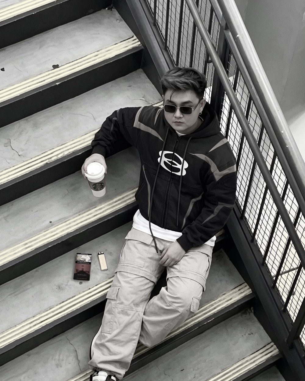 D sitting on stairs