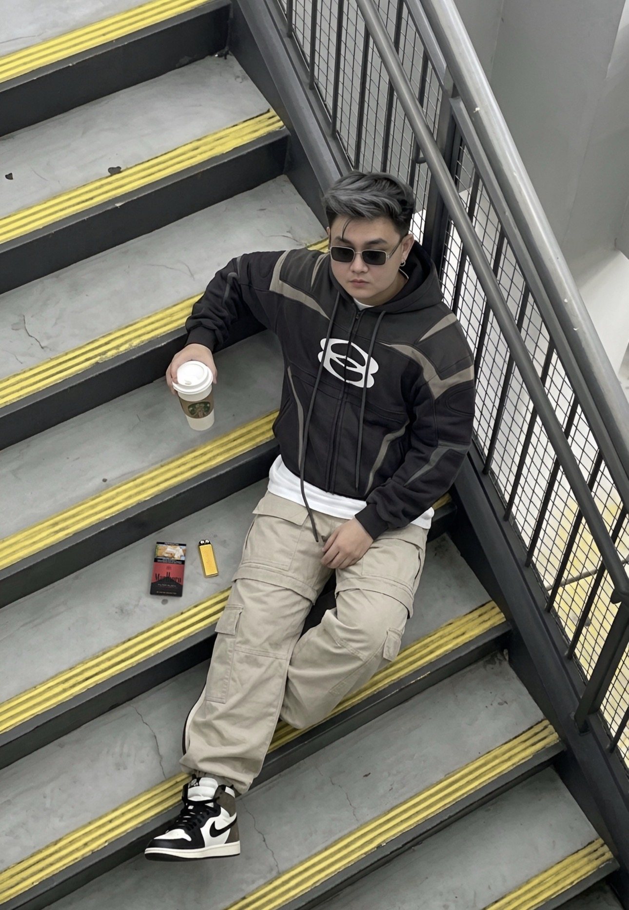D sitting on stairs
